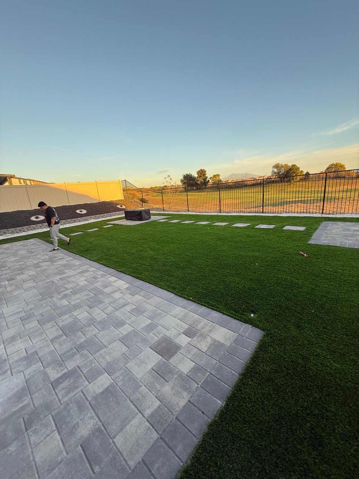 Paver patio and turf at evening