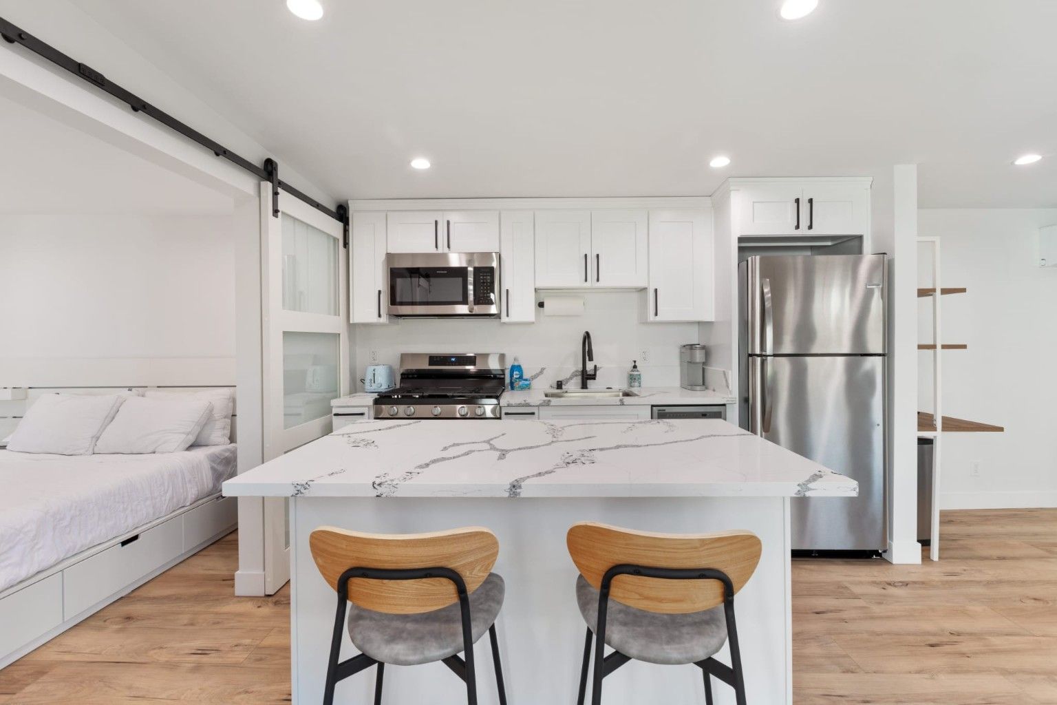 Bright kitchen with a white island and seating