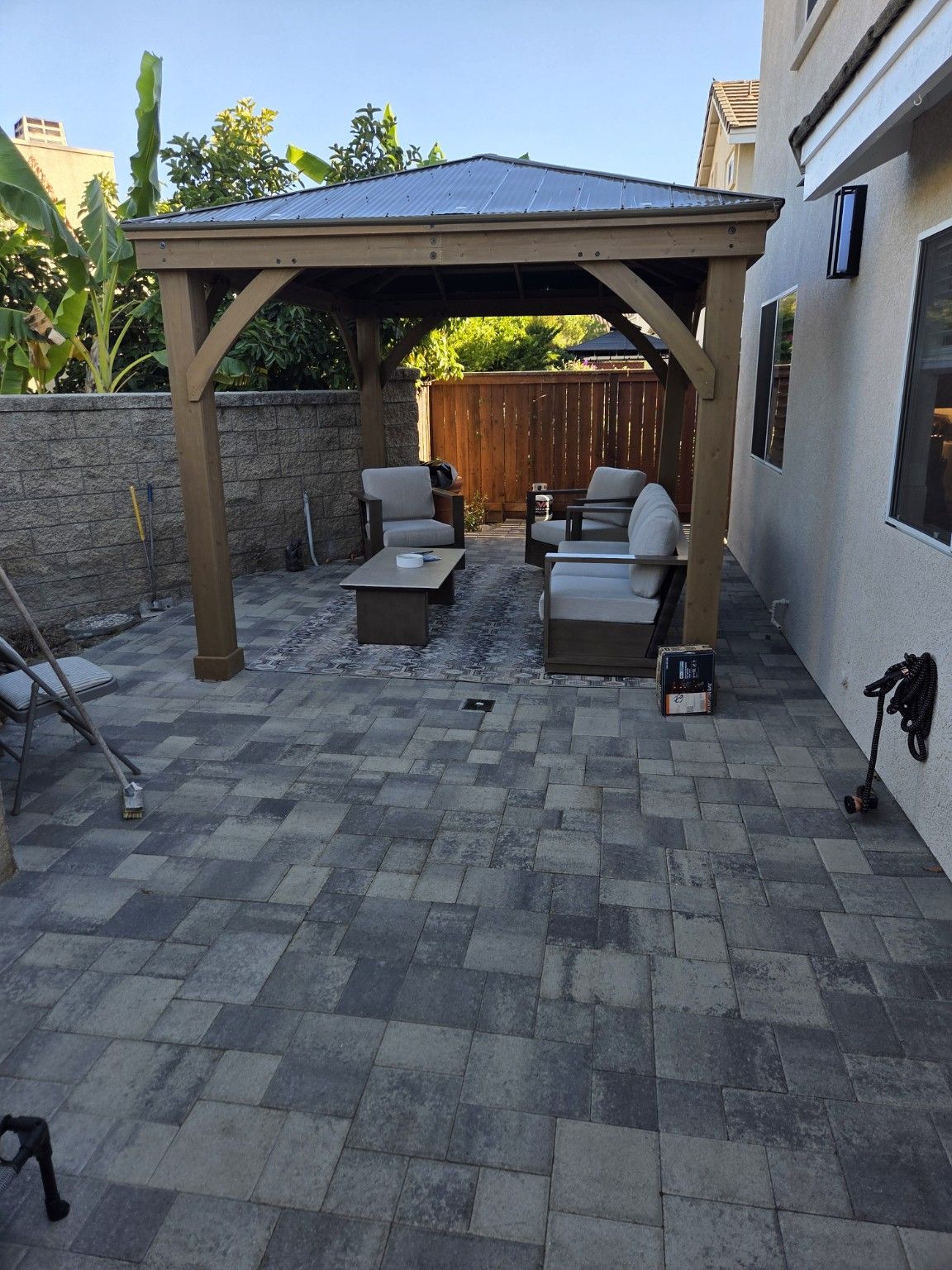 Covered patio seating on new pavers